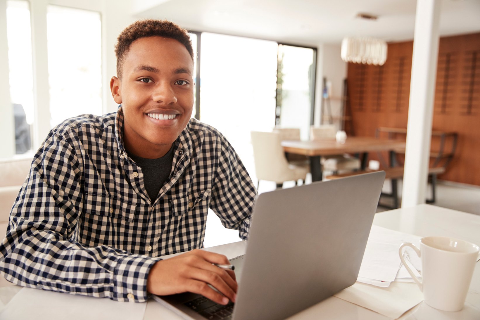 Teenager Using a Laptop at Home