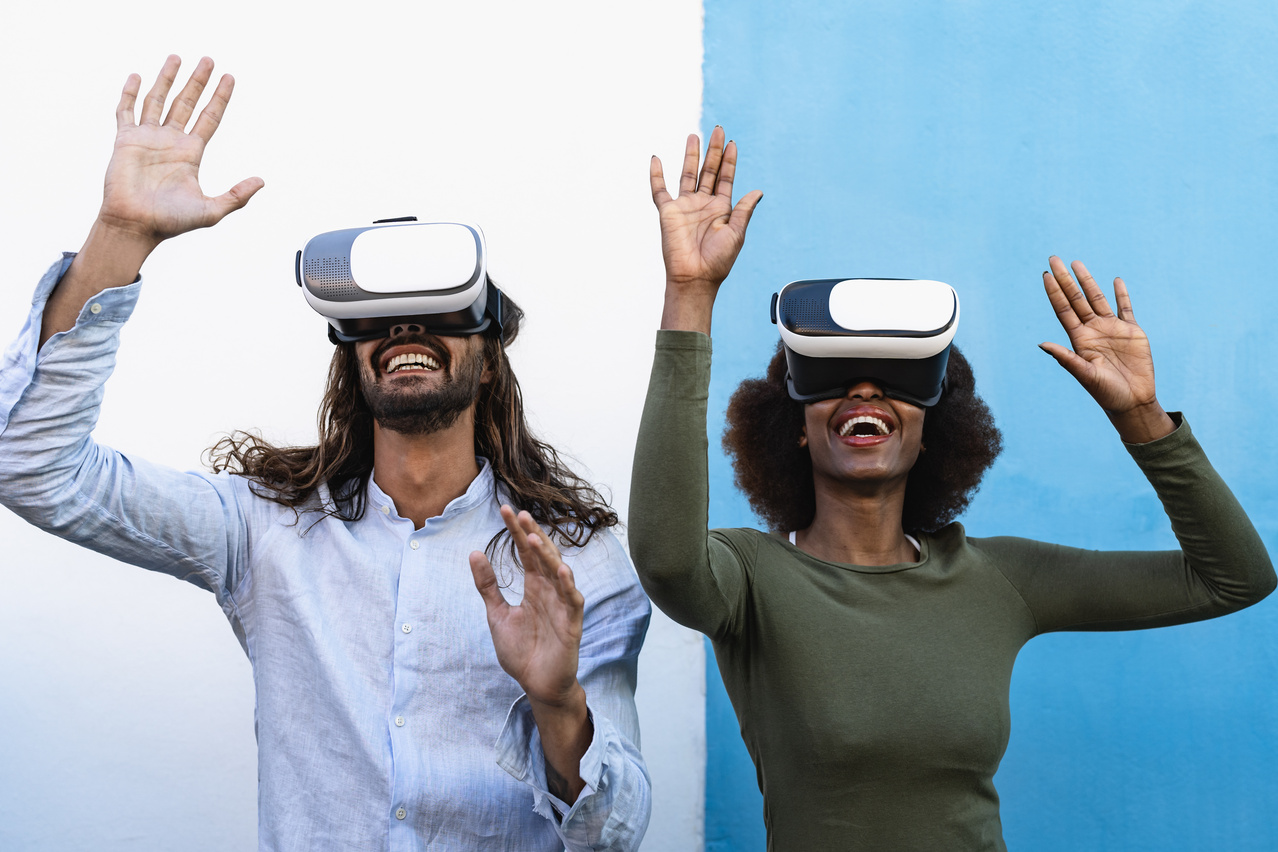 Happy friends having fun playing with innovated virtual reality glasses - Tech gaming entertainment and metaverse concept