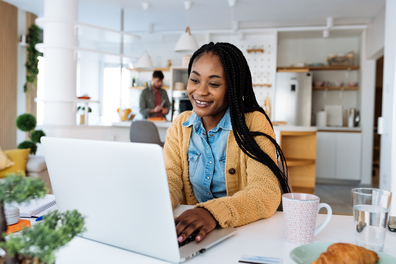 Adult African woman attending online course