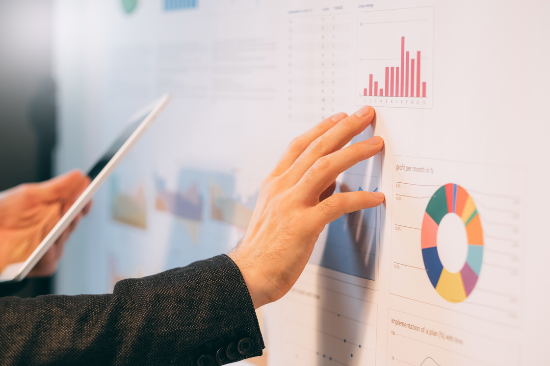 business analyst studying company growth rates