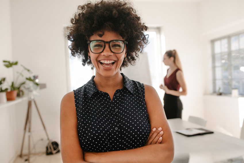 Woman Laughing during Presentation in Office