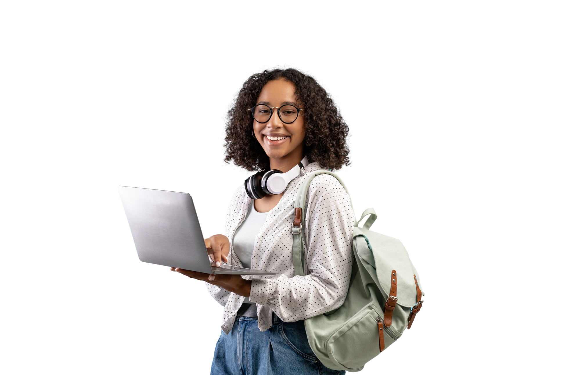 Cheerful young black woman with backpack and headphones holding laptop pc over blue studio background
